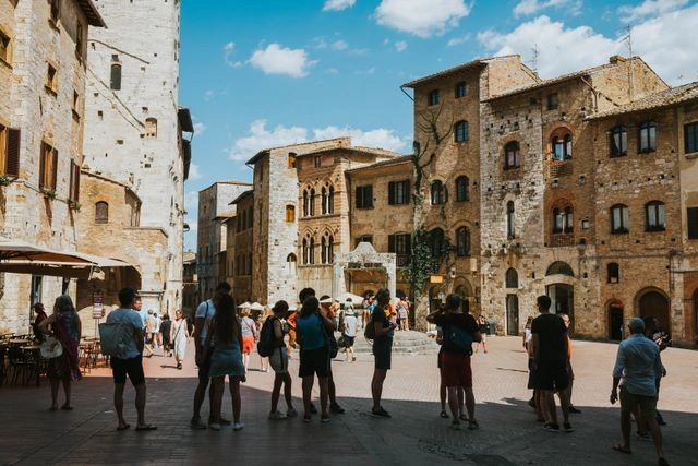 Why Guided Holidays Are Worth It — Tour Group Exploring a Historic Italian Piazza