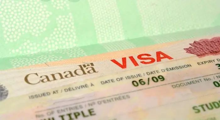 Close-up of a Canadian visitor visa in a passport, the document the Canada eTA for travelers from Indonesia and Malaysia can replace