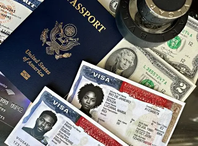 US passport with two visa documents and cash, the paperwork side of international dating and moving abroad