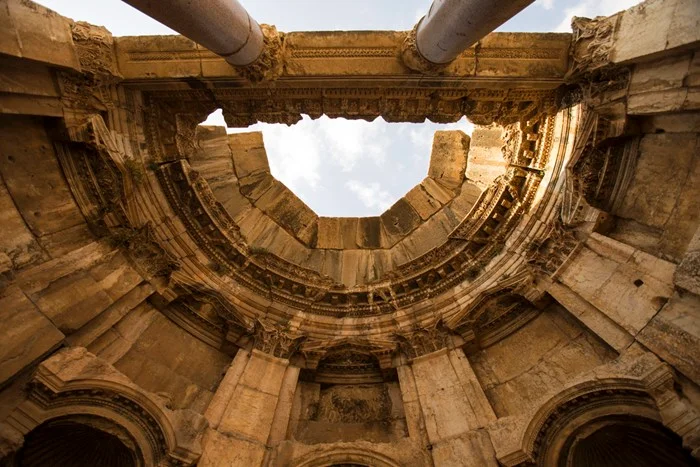 Looking up at carved Roman stonework inside an ancient temple at Baalbek, Lebanon, one of the country's most impressive sights to see on a guide-led visit