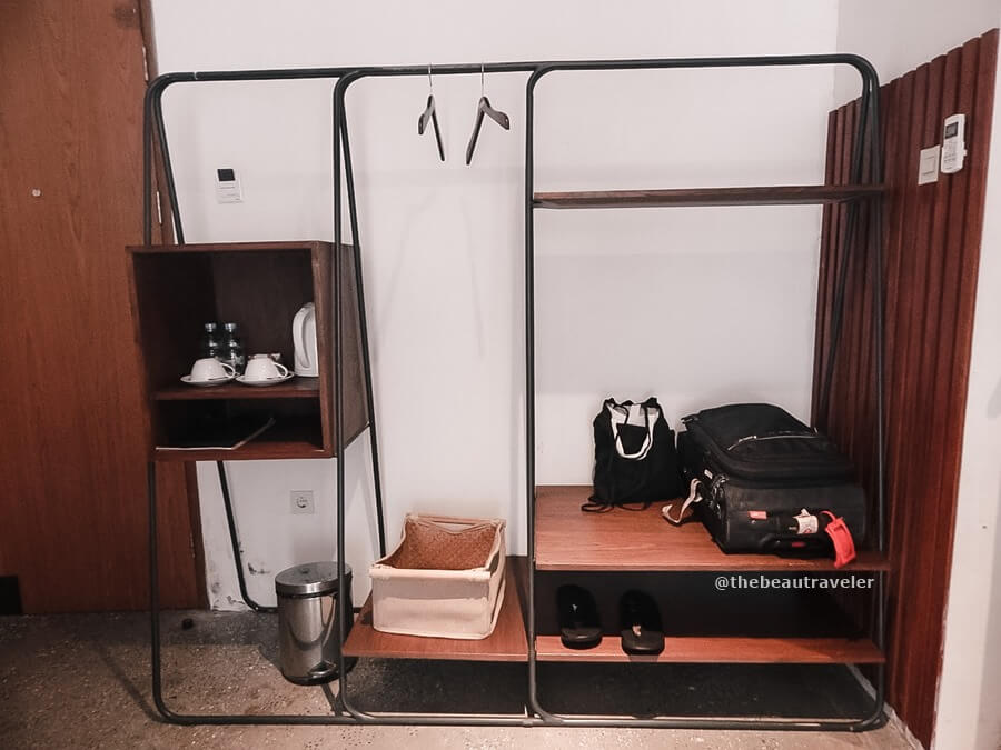 The minimalist capsule closet in the room.