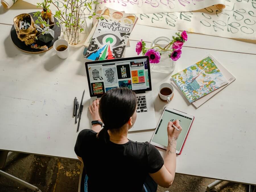 a woman in front of her computer. 