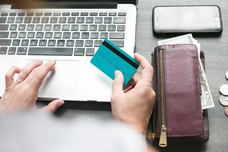 booking bus ticket with a credit card. 