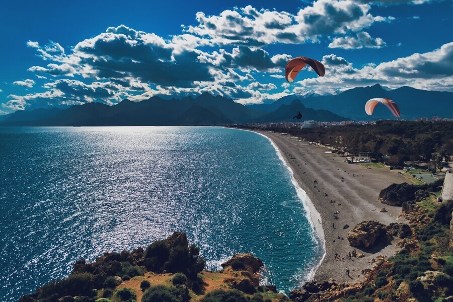 Paragliding at Konyaalti Beach in Altalya, Turkey. 