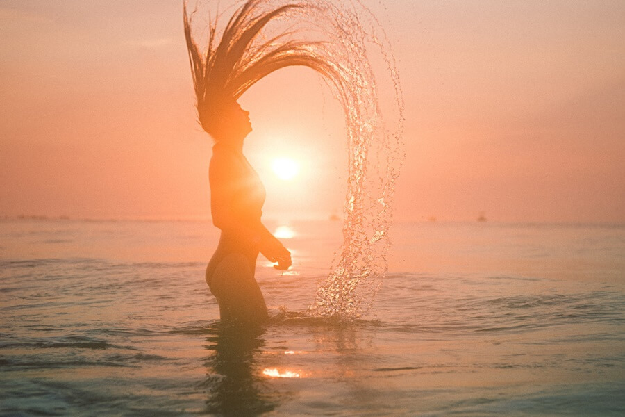 flipping hair around the beach. 