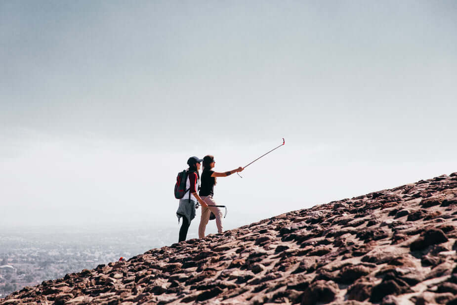 travelers taking a selfie together. 