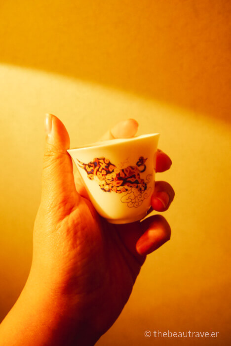 The small tea cup in the travel tea set package from Umi Tea Set.
