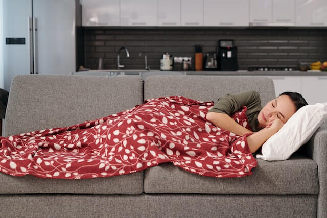 woman sleeping on a couch
