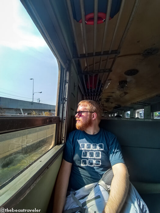 My boyfriend on the Death Railway train.