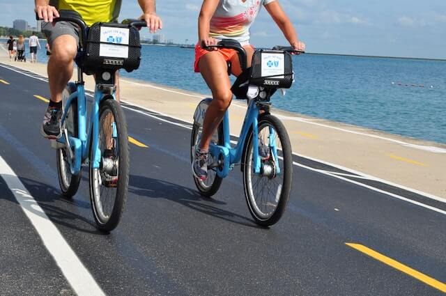 two people riding bikes