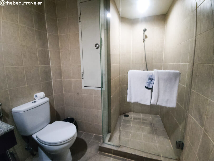 bathroom in the Queen Deluxe Room at Grand Dafam Ancol in Jakarta.