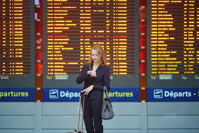 a woman waiting for the flight at the airport