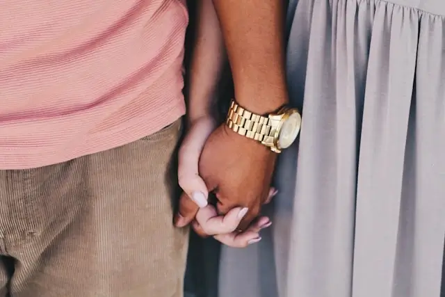 interraciap couple holding hands