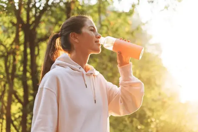 a woman drinking water