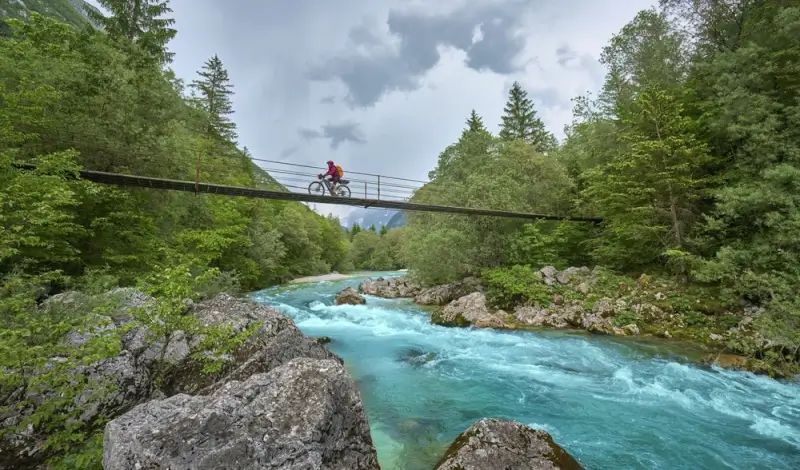 Biking through the bridge around River Soca, Slovenia.