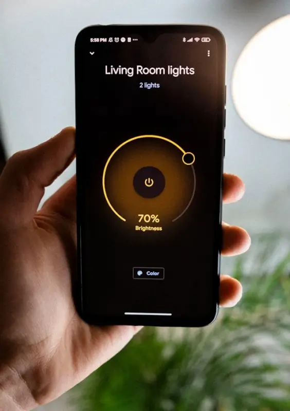 Smart light control panel showing Living Room lights with 2 connected bulbs, set to 70% brightness and adjustable color settings