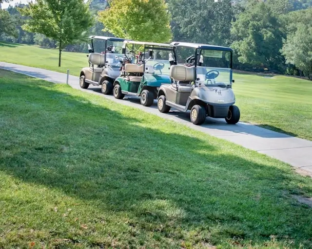 golf carts on a hilly road