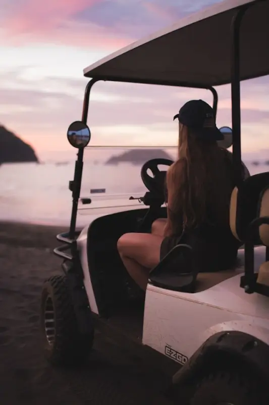 golf cart on a sandy beach