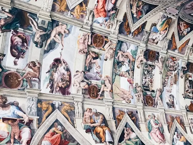 Michelangelo's masterpiece frescoes cover the Sistine Chapel ceiling, featuring intricate biblical scenes with figures of prophets, sibyls, and Genesis stories arranged within architectural framework