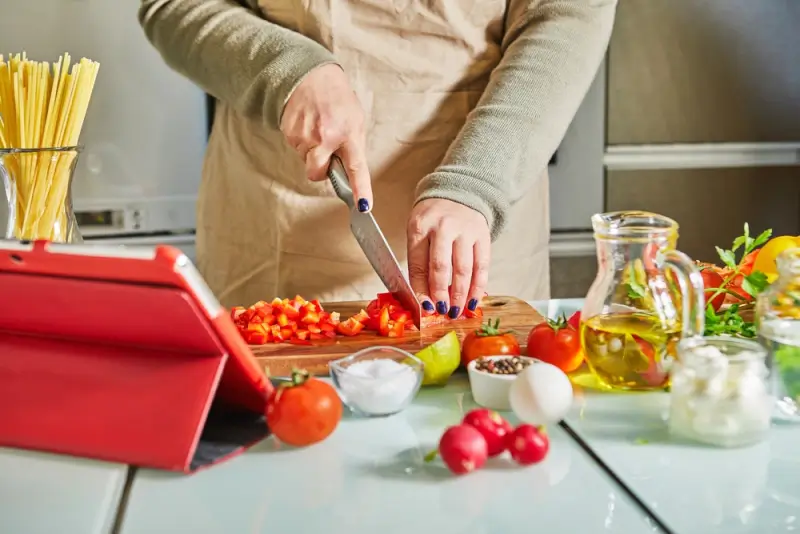 Hands-on culinary training class with fresh ingredients during cooking course abroad