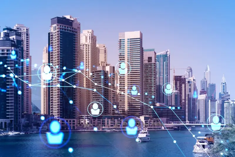 Dubai Marina skyline with digital network connections overlay, representing smart city infrastructure and technology-driven business opportunities in UAE