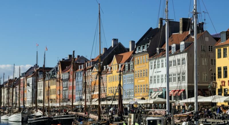Nyhavn Copenhagen Denmark colorful 17th-century townhouses and historic sailing ships along the famous canal harbor district