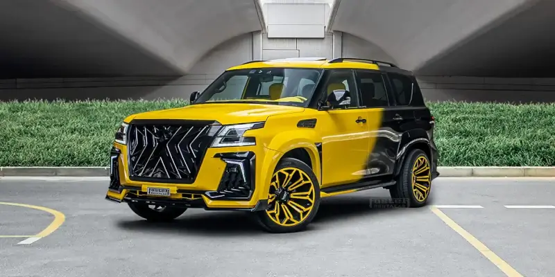 Yellow luxury SUV with black accents and custom wheels parked in modern Dubai parking garage