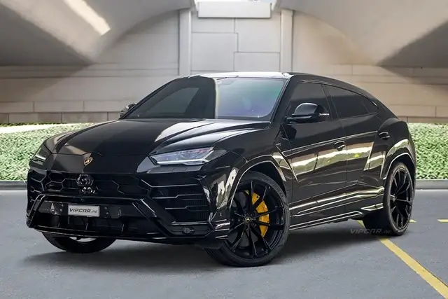 Black Lamborghini Urus luxury SUV parked in modern garage showing high-end vehicle requiring comprehensive car insurance coverage
