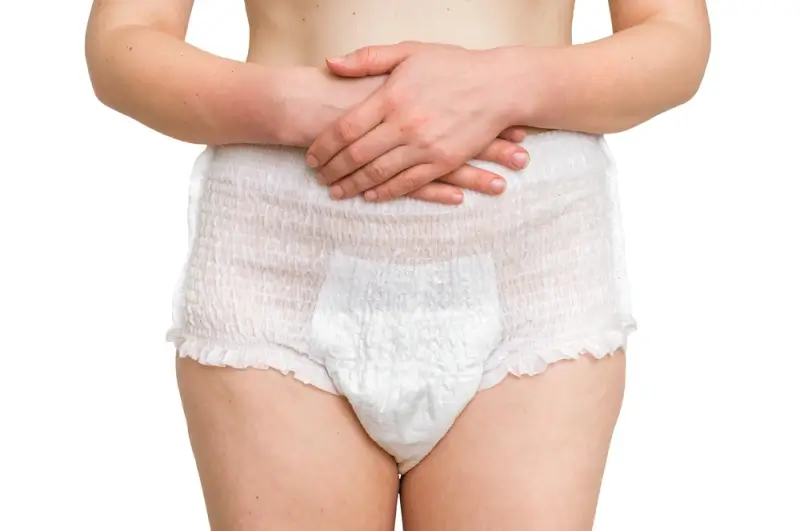 Close-up of white disposable underwear for adults showing thin profile and comfortable fit for travel