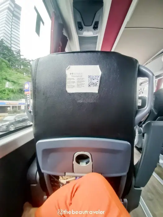 Bus seat with QR code and cup holder on Turkey-Georgia route showing modern amenities for long-distance travel