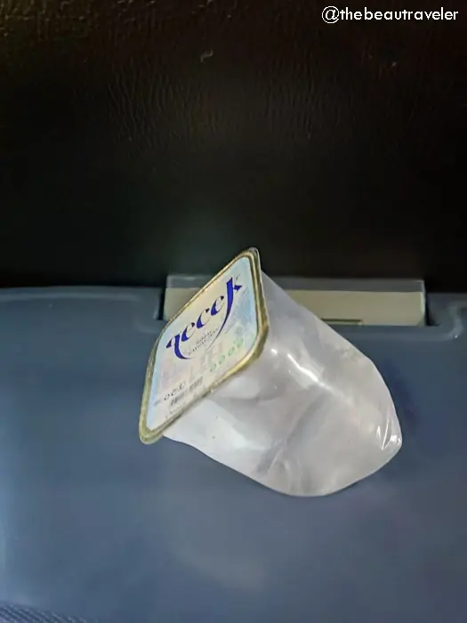 Water bottle provided on Turkish bus during long-distance journey from Georgia to Turkey border crossing route