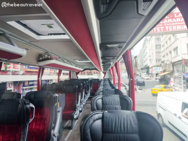 Interior view of Turkish bus with leather seats arriving in Istanbul after Georgia to Türkiye border crossing journey