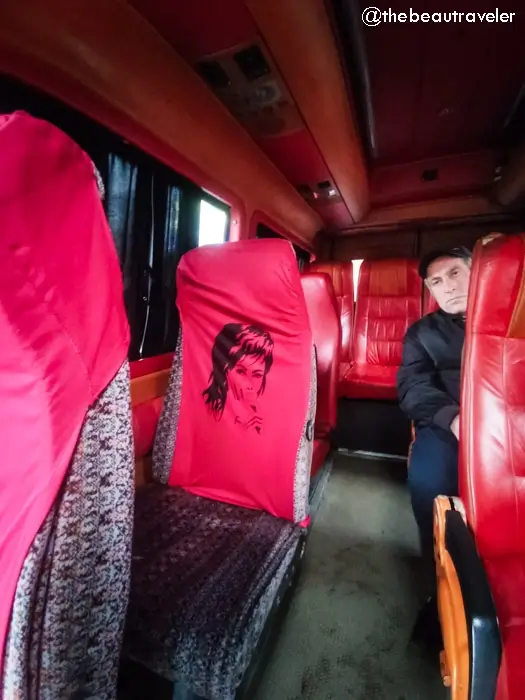 Interior of marshrutka with red leather seats during Turkey to Georgia border crossing journey