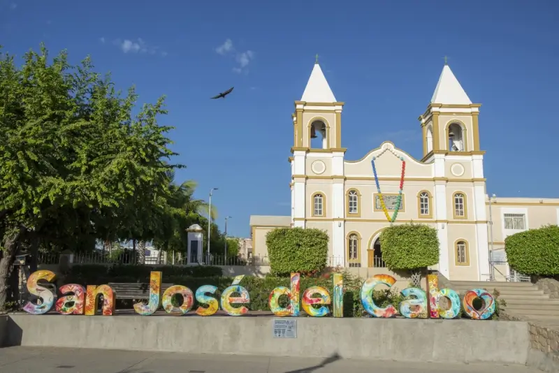 Historic San José del Cabo church with colorful town sign near Palmilla Los Cabos