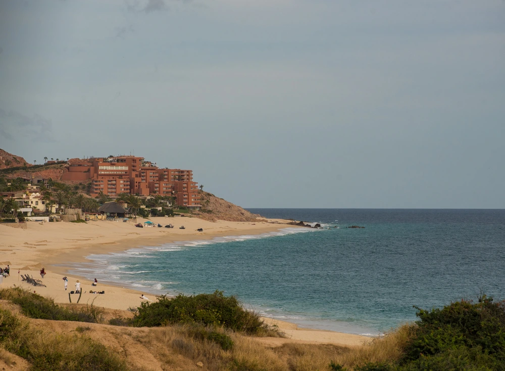 Playa Palmilla beach with luxury resorts and swimmable waters in Los Cabos Mexico