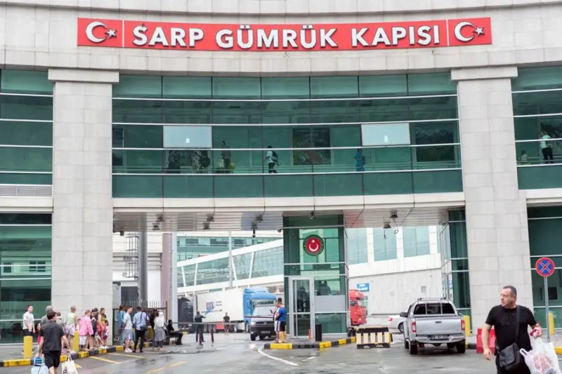 Sarp border gate building on Turkish side with travelers crossing between Turkey and Georgia at main border checkpoint