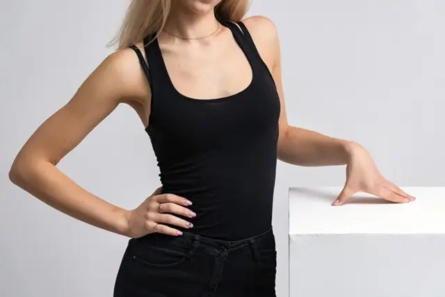 Black square neck bodysuit for women showing flattering fit and versatile styling for travel outfits