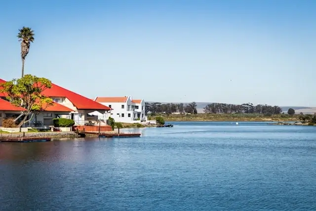 Waterfront vacation rental properties and unique accommodations along scenic lake offering flexible travel alternatives