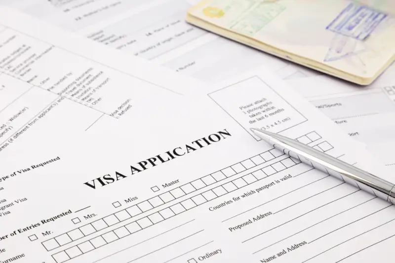 Japan visa application form with Indian passport and pen showing required documents for Japan visa process