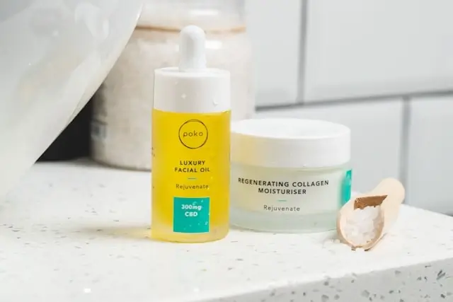 Face serum and moisturizer products arranged on bathroom counter showing proper skincare routine order