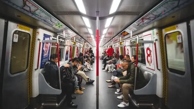 Passengers using public transportation subway train for budget-friendly weekend travel