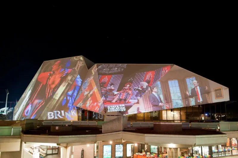 Adelaide Festival Centre illuminated with colorful projection mapping at night showcasing cultural performances in South Australia