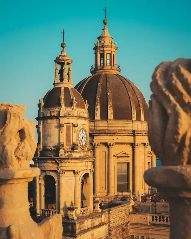 Baroque church domes and bell towers in historic Palermo Sicily at golden hour