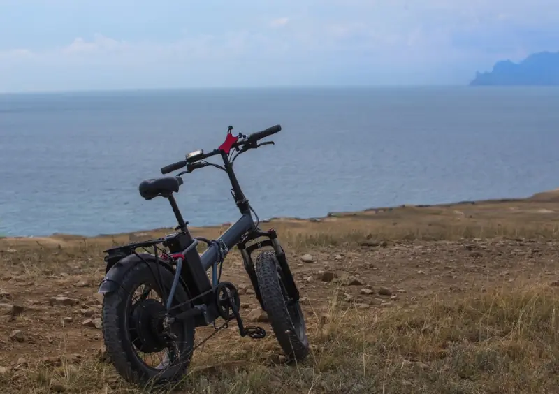 E-bike overlooking serene ocean view.