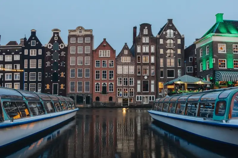 facades of ancient building around the canals in amsterdam, the netherlands.
