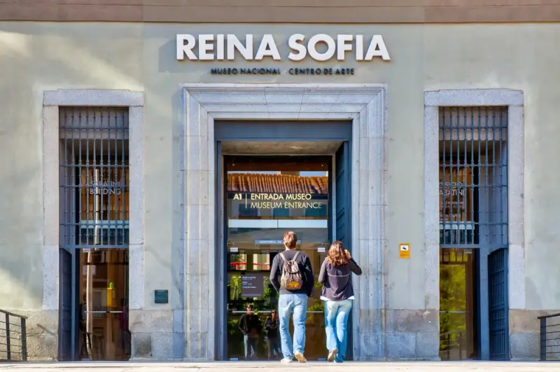 Visitors entering Reina Sofia National Museum entrance in Madrid, Spain's premier modern art gallery