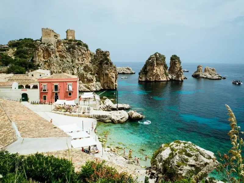 Scopello seaside village with turquoise water rocky cliffs and ancient tuna fishery in Sicily
