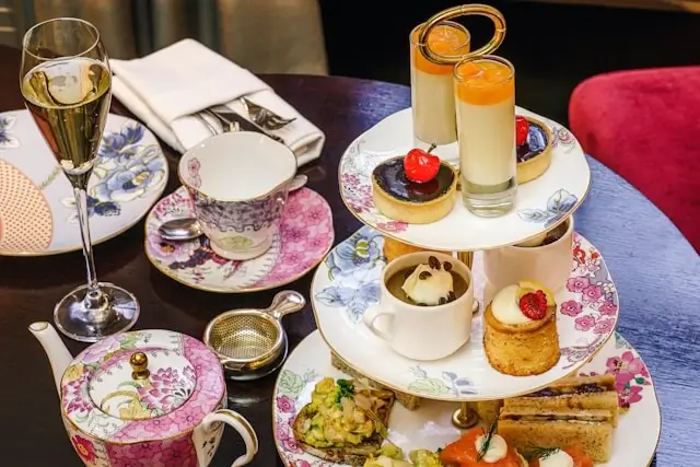 Elegant afternoon tea service with pastries and champagne to make the most of your trip