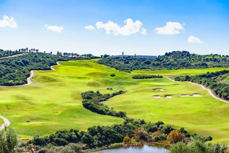 Championship golf course in Andalusia Spain with undulating fairways and coastal landscape