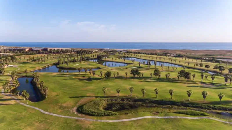 Spectacular golf in Europe featuring Algarve Portugal oceanfront course with water hazards and palm trees